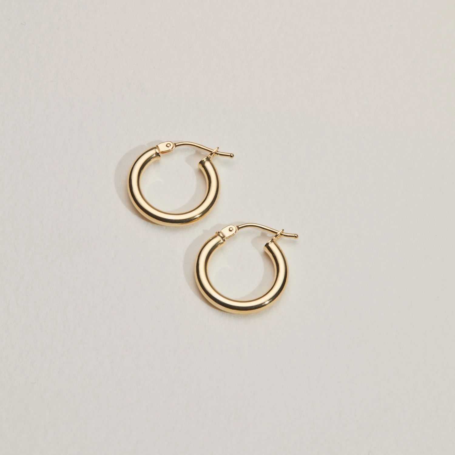 Solid Gold Small Rounded Hoop Earrings - Image 3