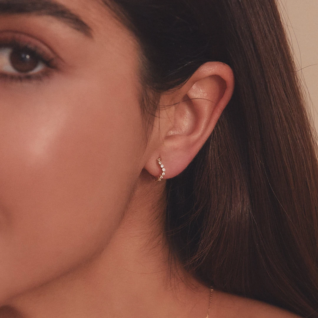 Gold Diamond Style Wave Huggie Hoop Earrings - Image 2