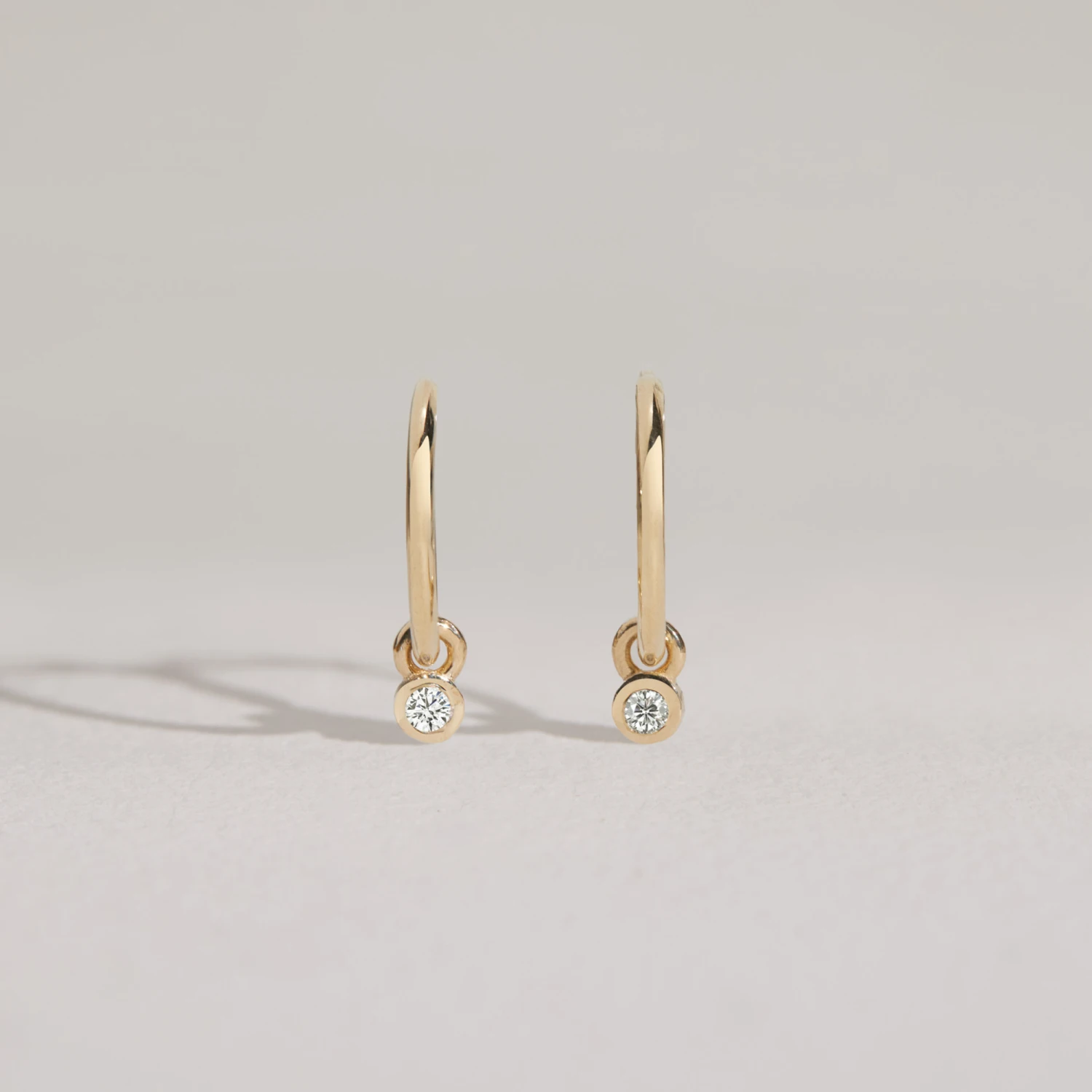 Solid Gold Mini Floating Diamond Hoop Earrings - Image 3