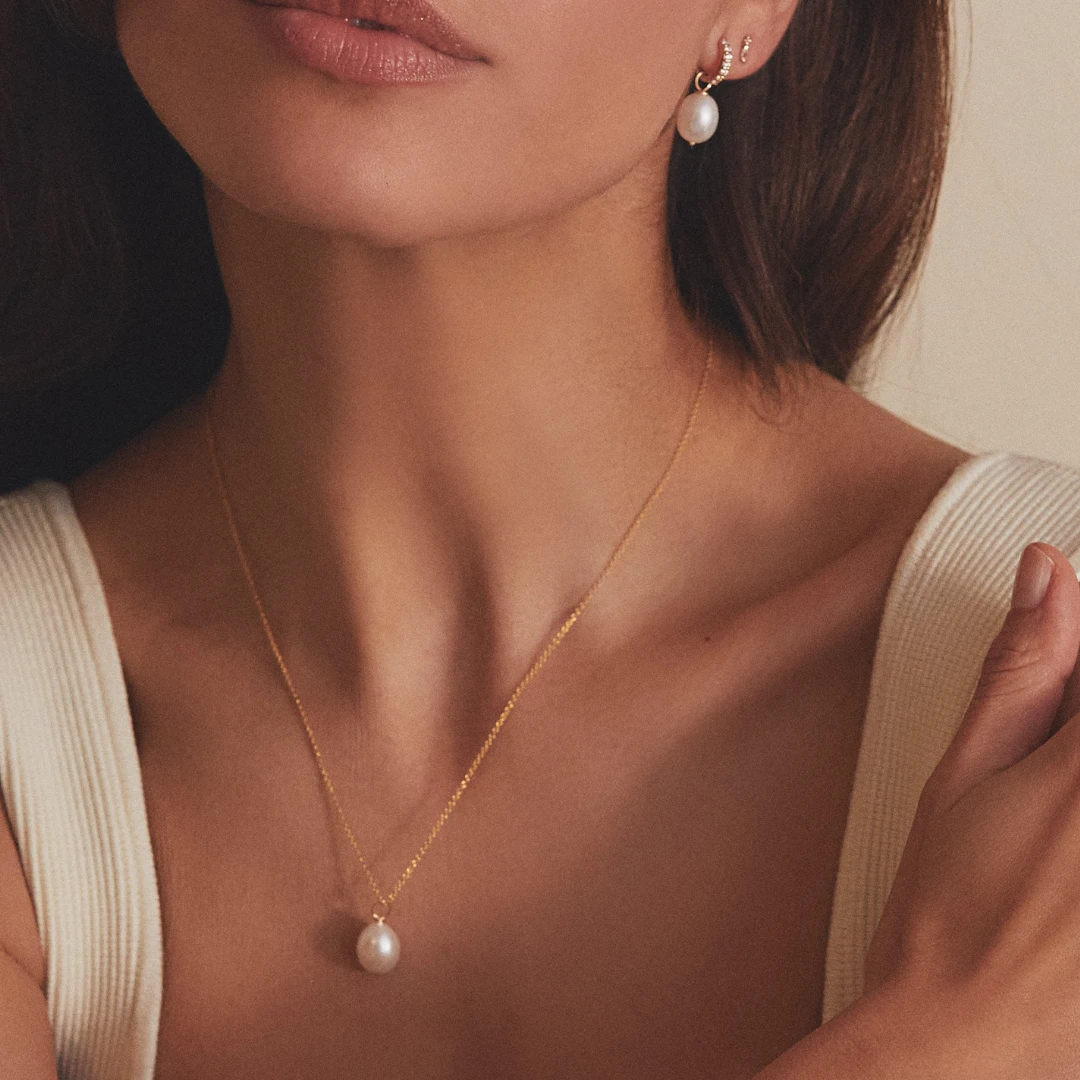 Gold Pearl Drop Huggies And Large Pearl Necklace Set - Image 2