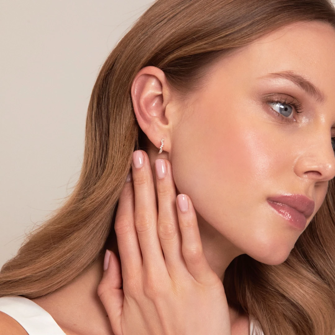 Gold Curved Diamond Style Huggie Hoop Earrings - Image 3